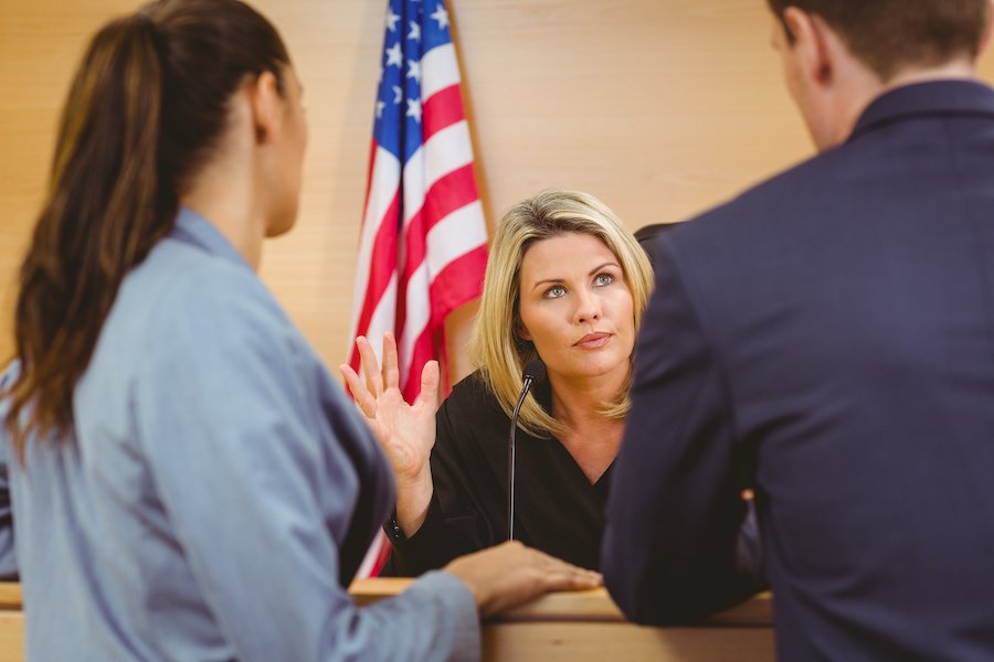 Judge talking to attorney and defendant