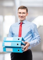 male accountant holding binders