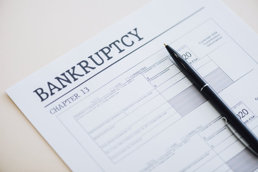 Paper that says "bankruptcy chapter 13" with a pen