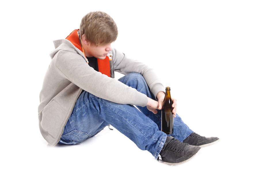 Boy holding a bottle of beer, which is illegal in Nevada. 