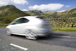 Car speeding on the right hand lane.