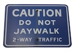 Traffic sign cautioning against jaywalking