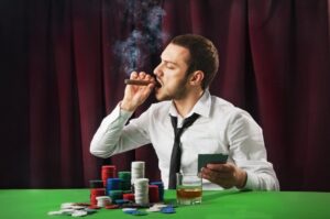 Man smoking cigar at casino card table. 