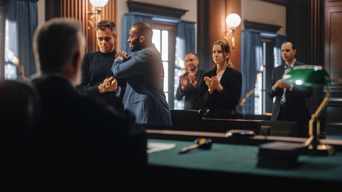 Defense attorney congratulating his client after getting a case dismissed due to a stale statute of limitations