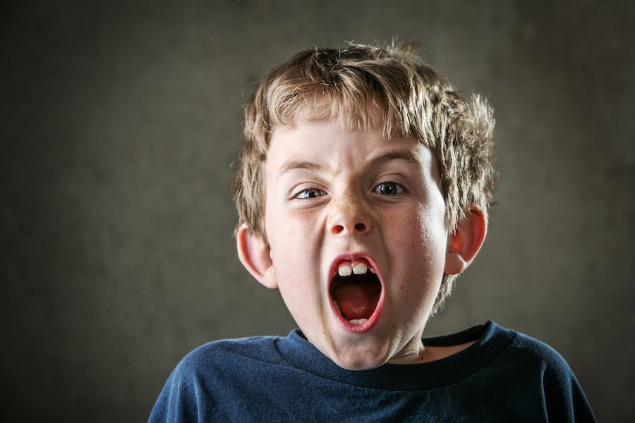 Young boy screaming and falsely accusing his parents of abuse
