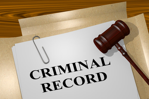 Gavel and paper that says criminal record, which can be sealed in certain Nevada felony cases. 
