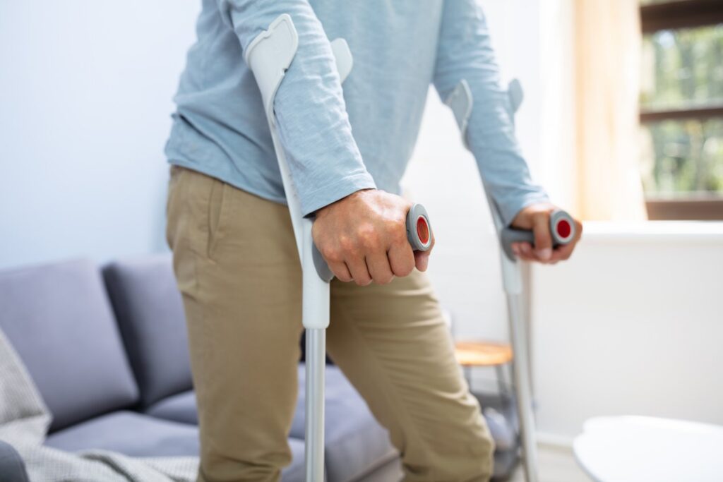 Man on crutches, which qualifies as an NRS 0.060 injury.