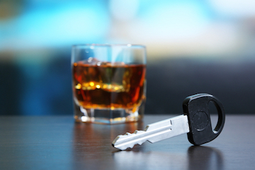a cocktail next to a car key