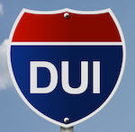 Sign that says "DUI" against a blue sky