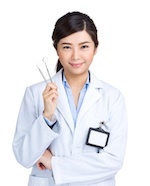 Dentist holding dentistry tools