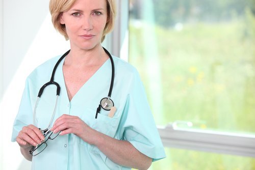 Female nurse by a window