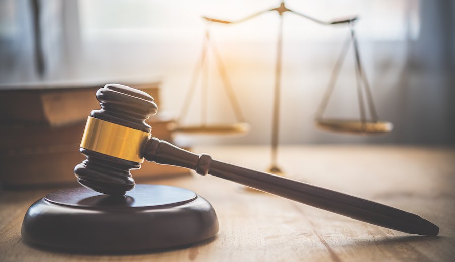 Judge's gavel against a scale of justice