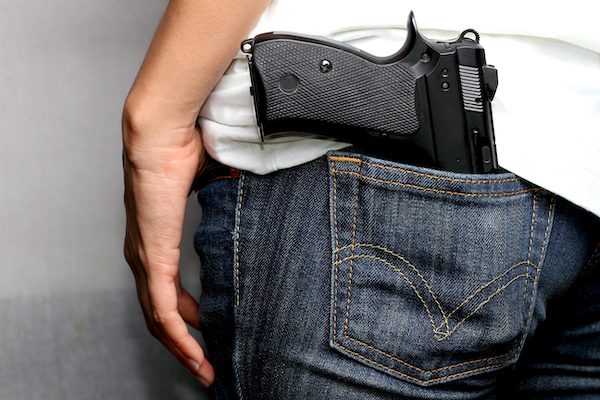 A gun in a man's back pocket. Defendants face increased sentencing for using a deadly weapon while committing a crime under NRS 193.165.