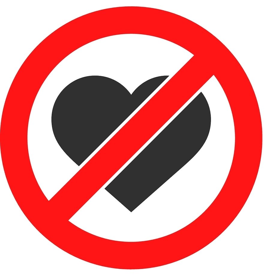 Graphic of a heart with a red cross out sign