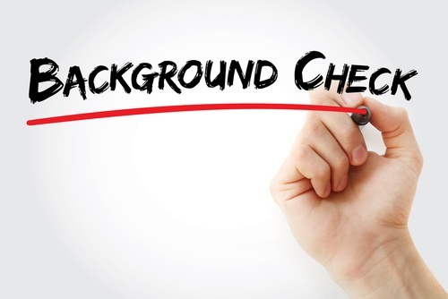 Hand writing "background check" with black marker and red underline