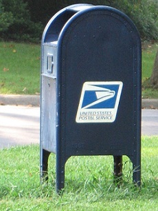 Traditional mailbox on green grass