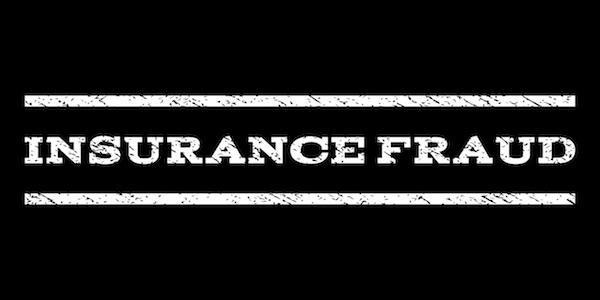 Black sign that says in a white font "insurance fraud," which is a crime in Nevada under NRS 686A.2815.