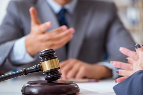Criminal defense attorney appearing before a judge on behalf of the defendant in a misdemeanor case.