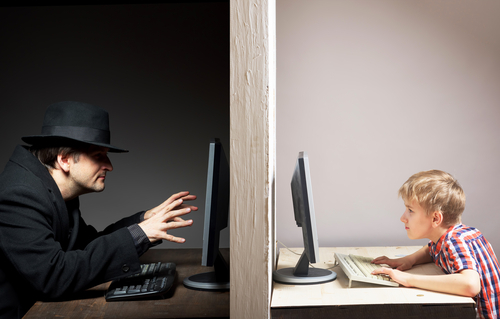 Evil looking man on computer violating NRS 201.560 on the left side of the picture with a child on a computer on the right side of the picture