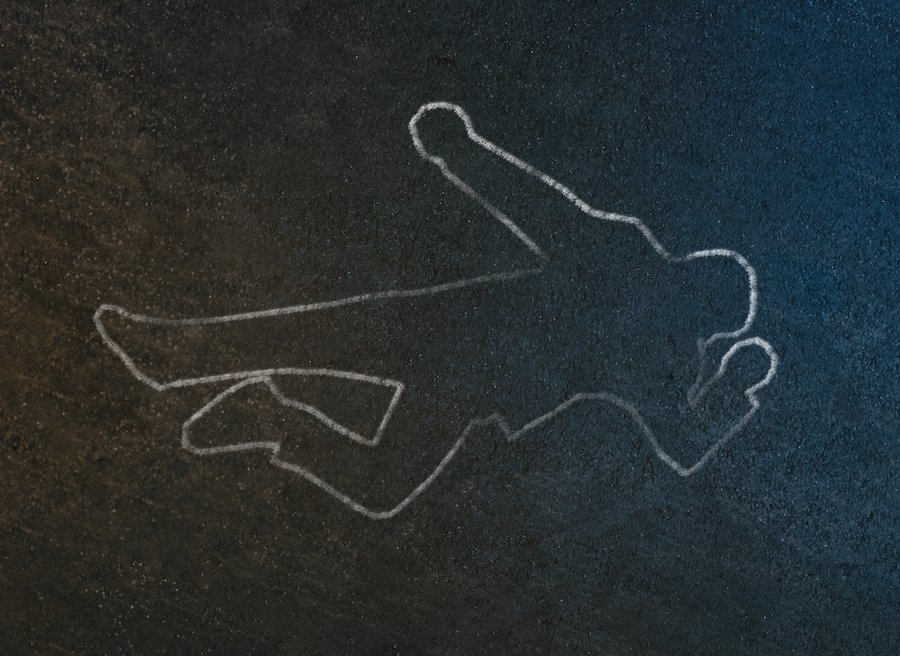 white chalk outline of body on the black ground