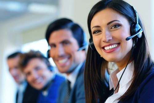Team of receptionists with headsets