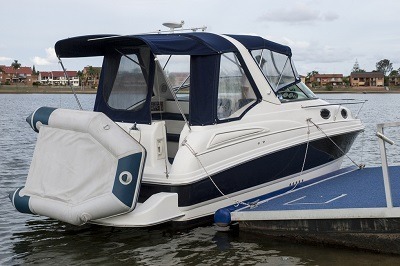 watercraft docked by pier