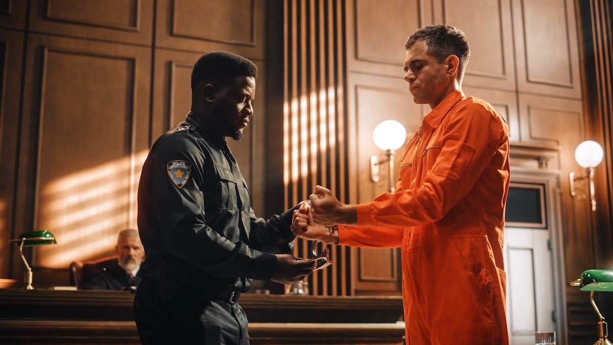 Bailiff uncuffing a probationer after a probation revocation hearing