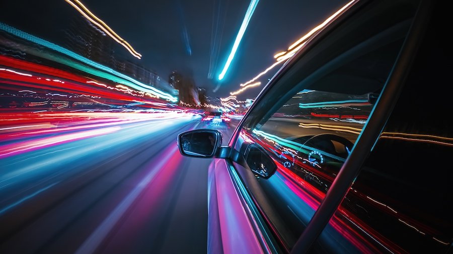 Car speeding down a busy street