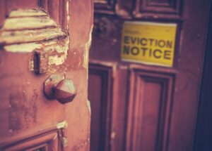 Door that says "eviction notice" which an evicted tenant enters in violation of NRS 205.082