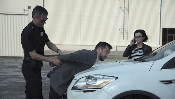 Man being arrested after contacting his ex-girlfriend in violation of a domestic violence protection order. 