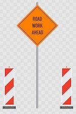 Traffic cones and 'Road Work Ahead' sign
