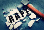 rape sign shattered by a hammer