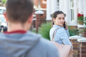 Young lady being stalked by a young man outside in violation of NRS 200.575