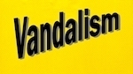 black sign with yellow background (NRS 381.225)