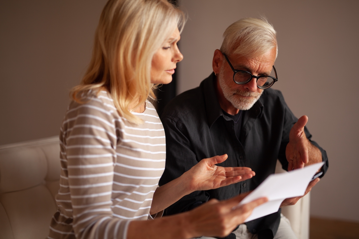 Older couple on their couch upset after being subpoenaed 