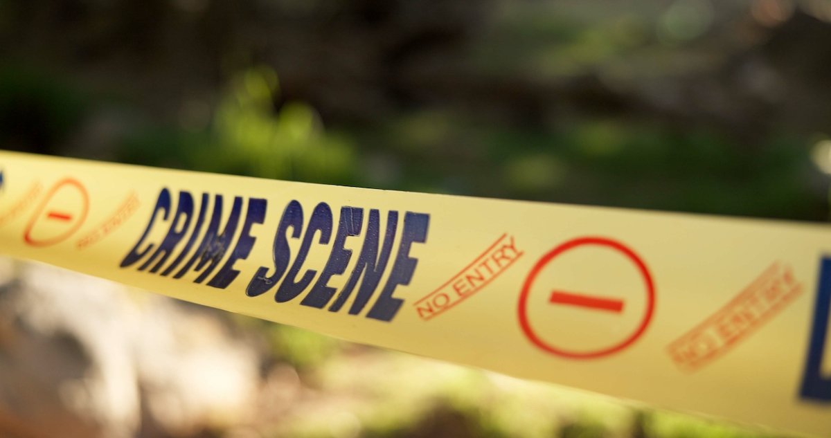 Yellow "crime scene" police tape cordoning off a crime scene
