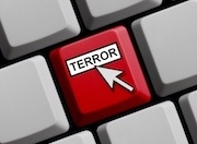 Closeup of a computer keyboard key that is red and labeled "terror" with a cursor arrow over it