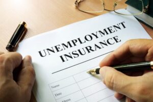Paper that says "unemployment insurance"