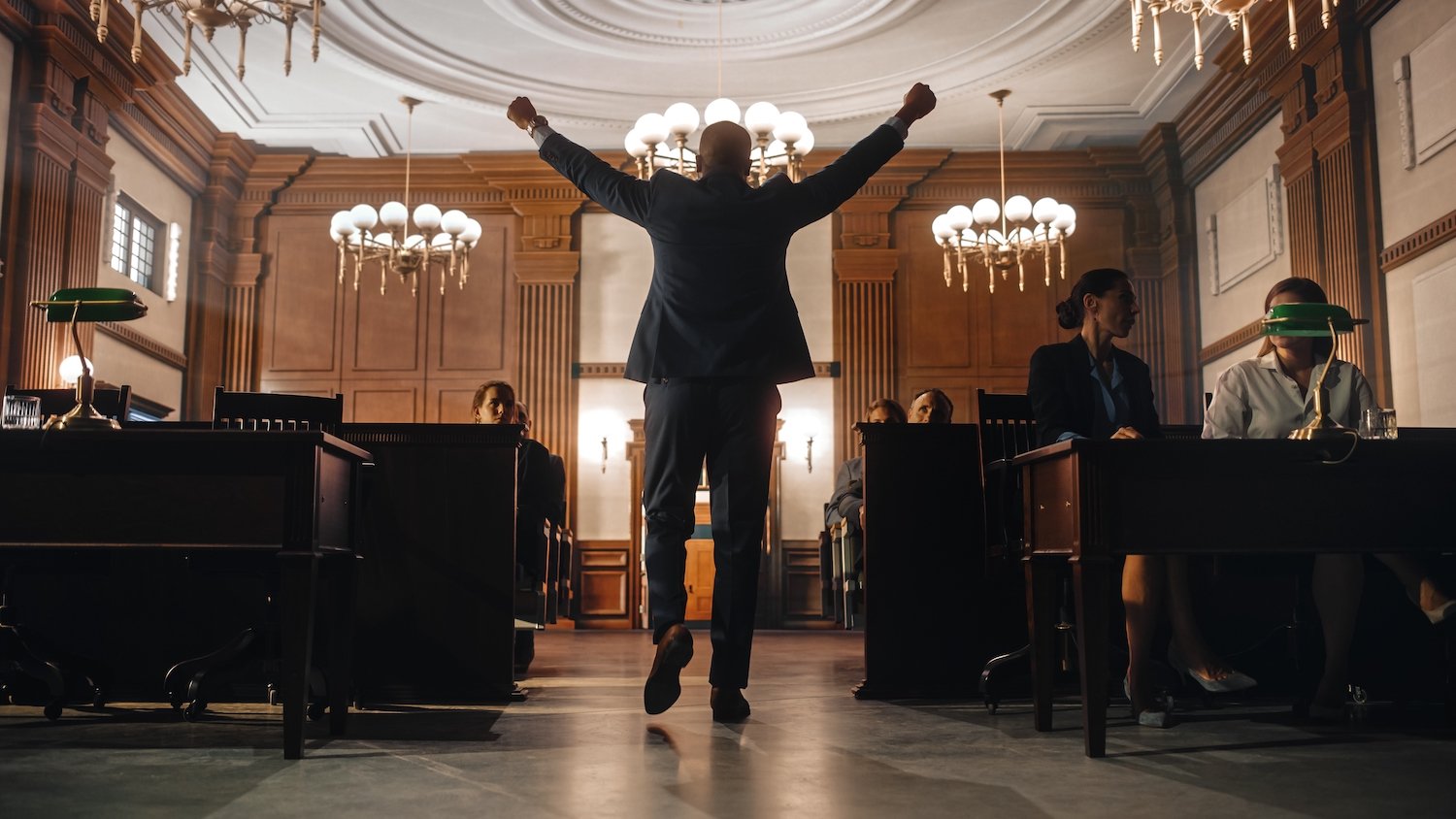 Defendant pumping his fists in victory in the courtroom