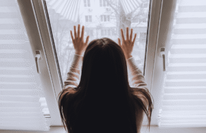 Woman on house arrest in Nevada looking through window